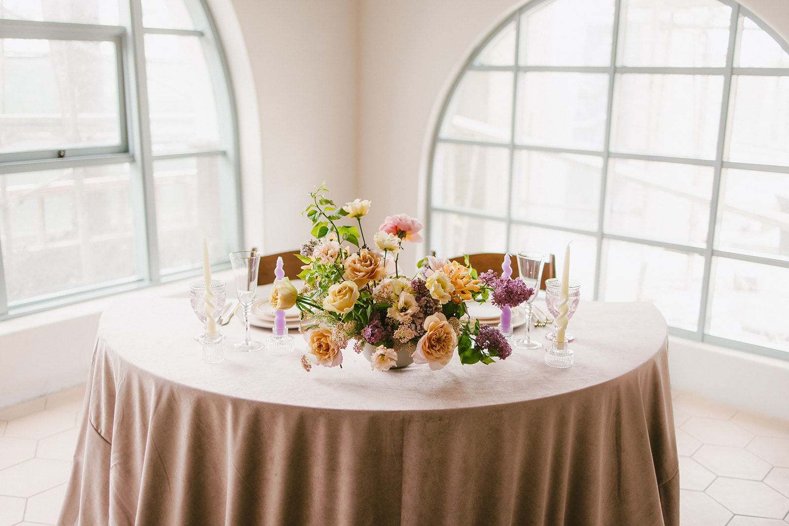 wedding reception head table with bright flowers at San Clemente Wedding Venue