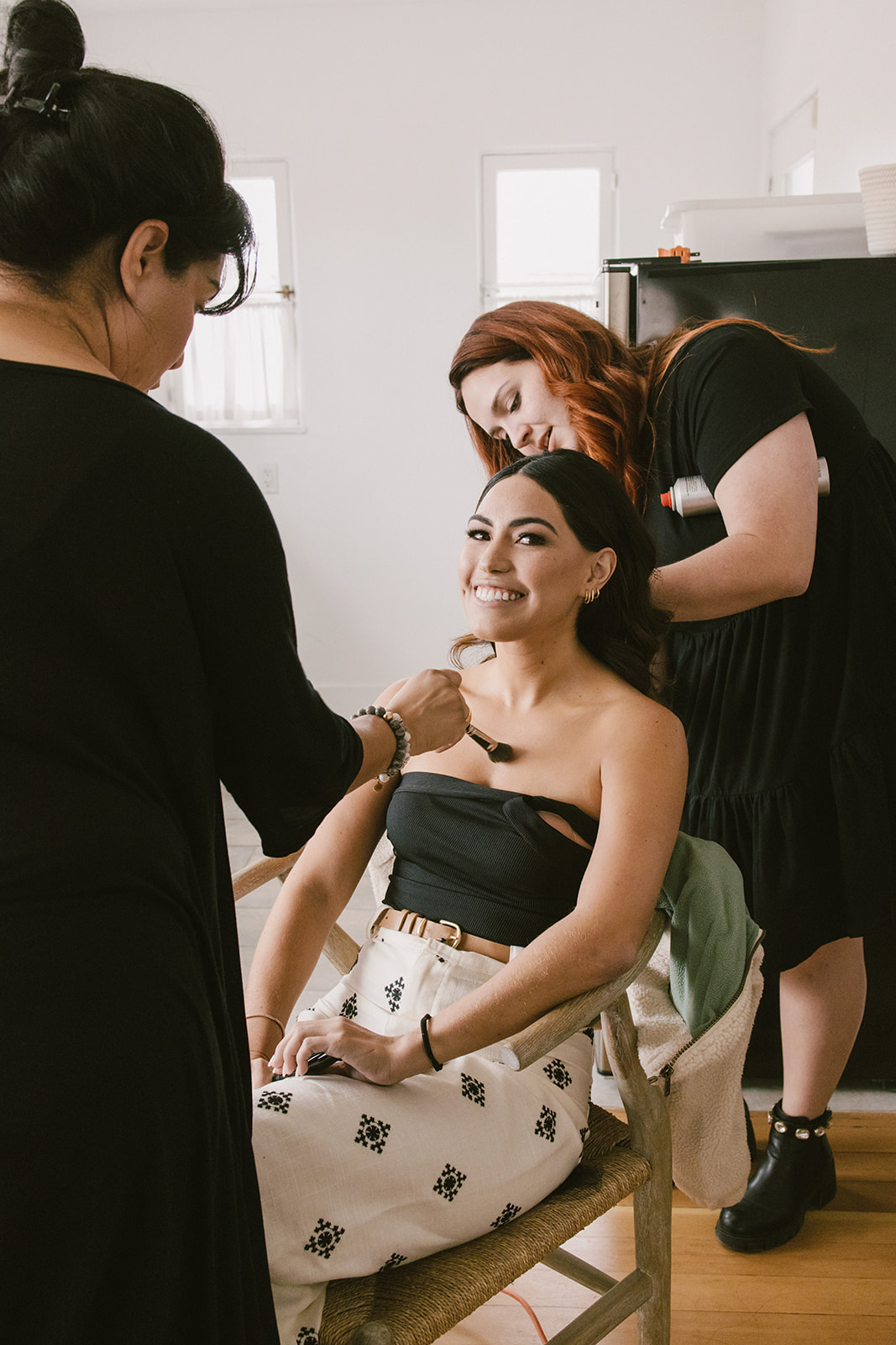 bride getting her makeup and hair done at San Clemente Wedding Venue