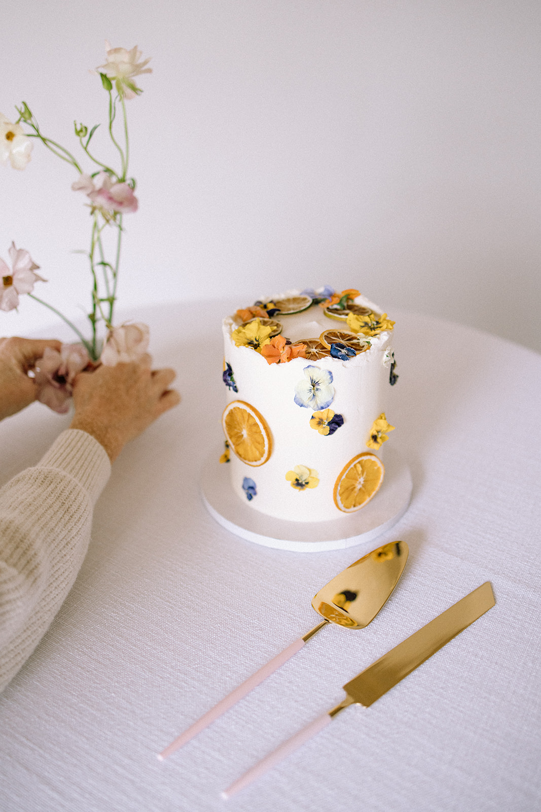 orange and floral decorated wedding cake 