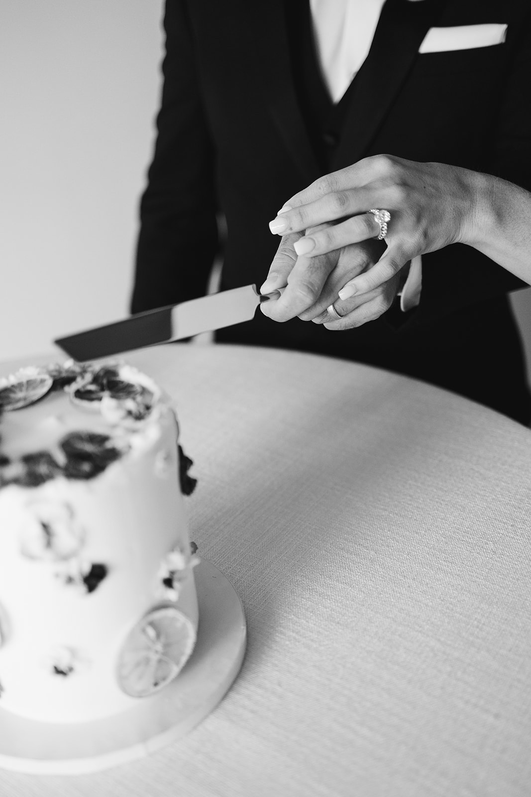 bride and groom cutting the cake 