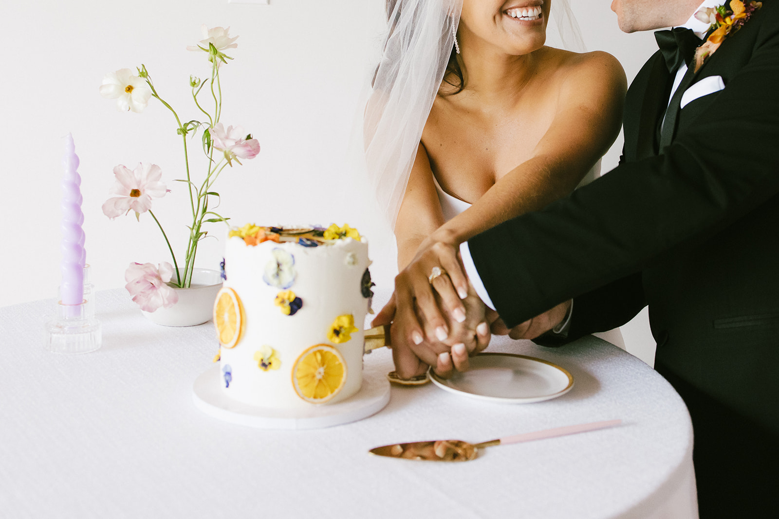 wedding couple cutting their wedding cake at San Clemente Wedding Venue