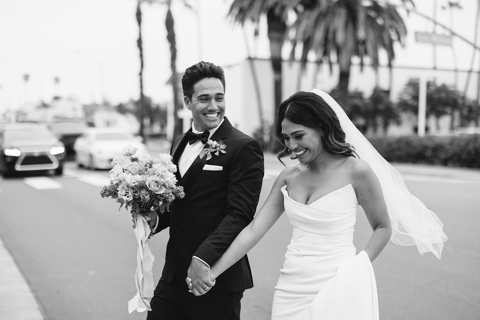 bride and groom walking from San Clemente Wedding Venue to the beach 