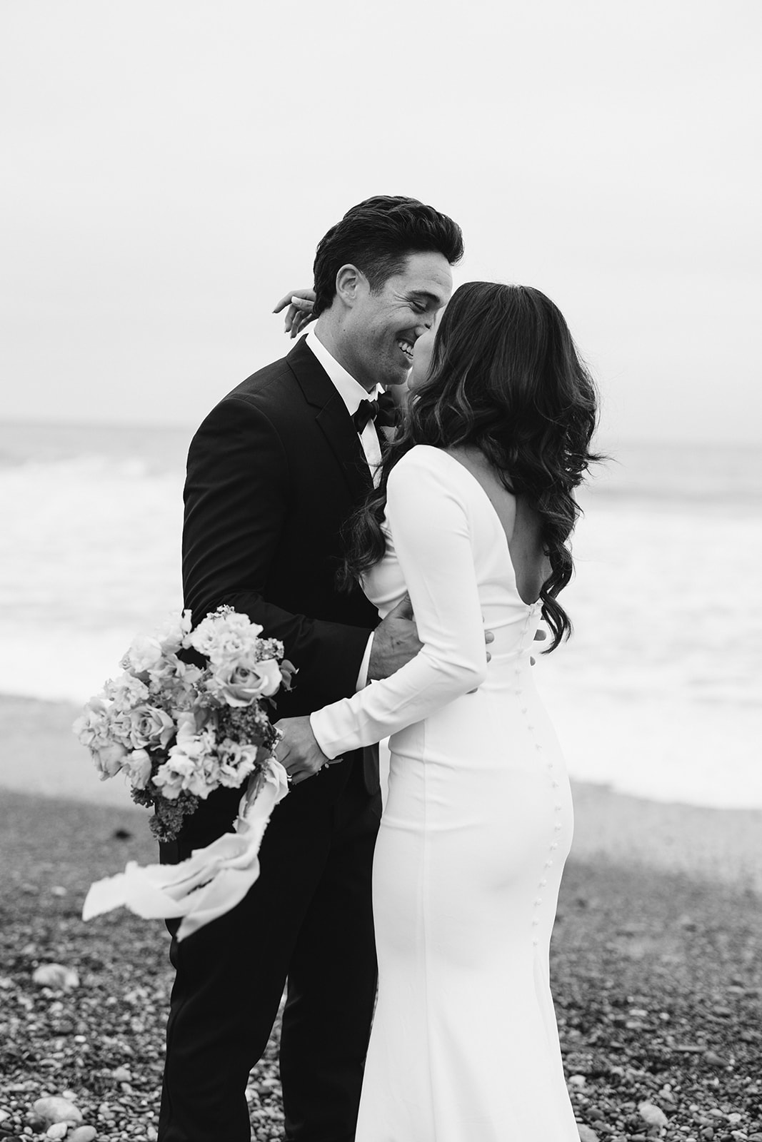 candid bride and groom photo on the beach 