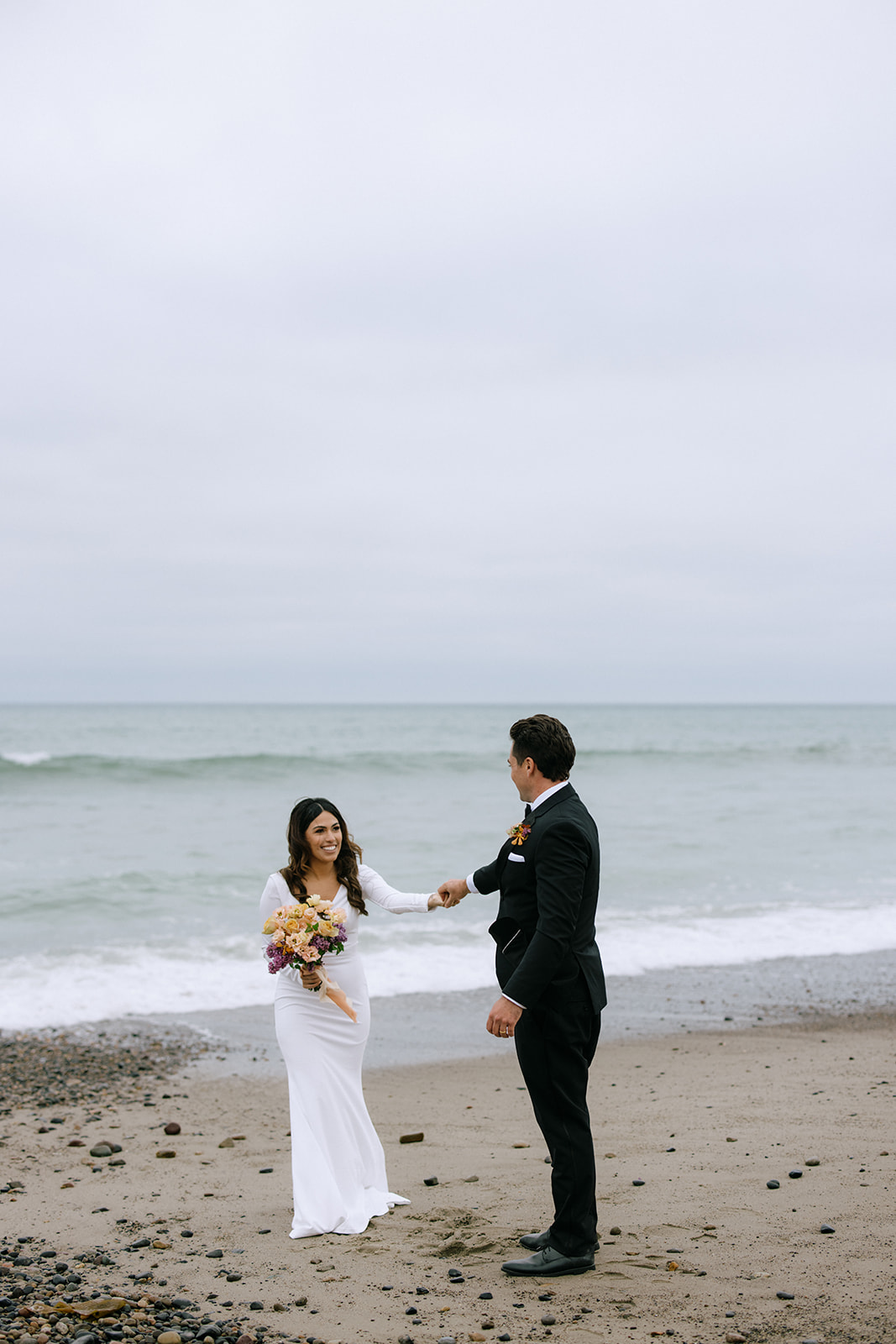 documentary beach wedding photos of bride and groom 