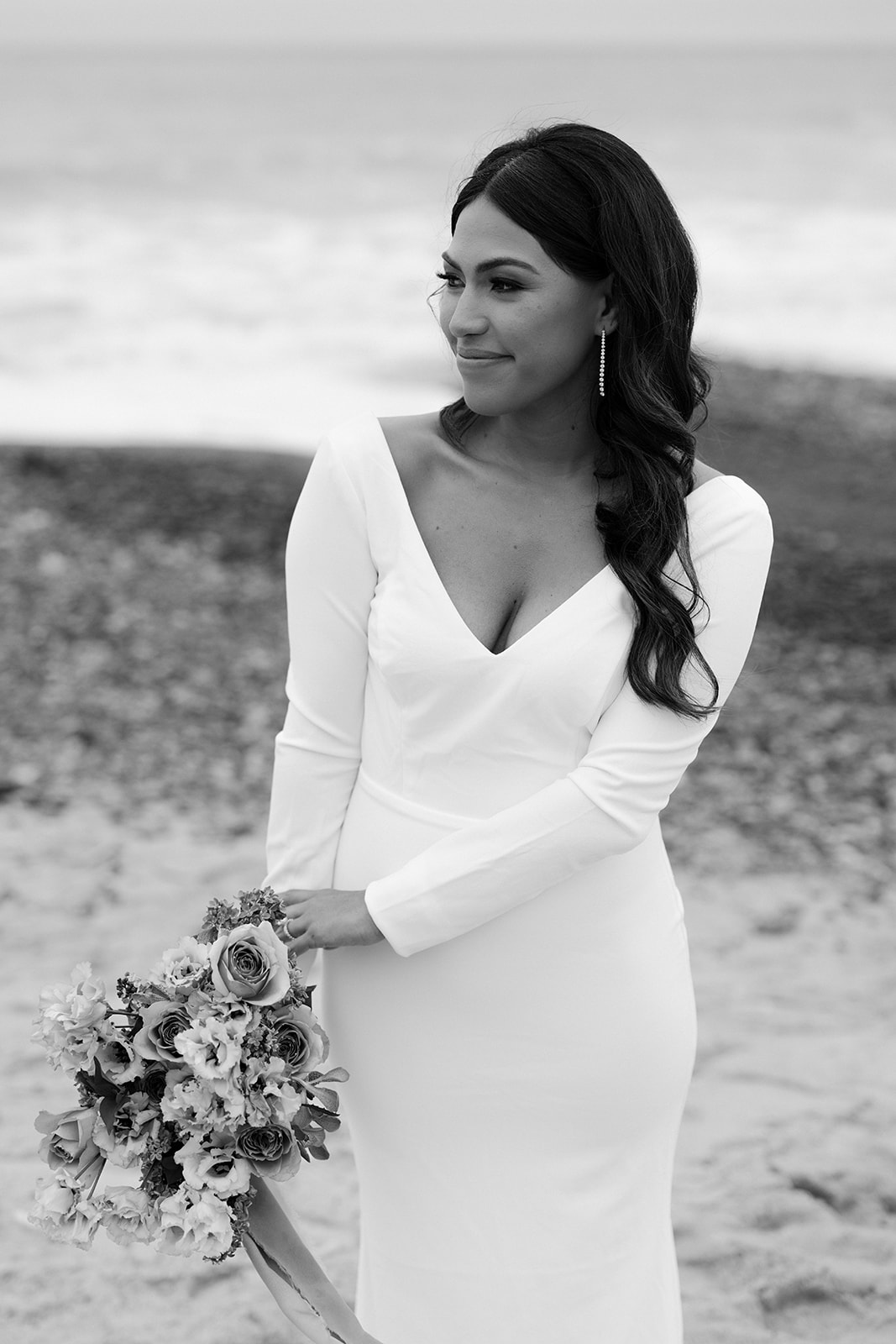 black and white photo of the bride on the beach 