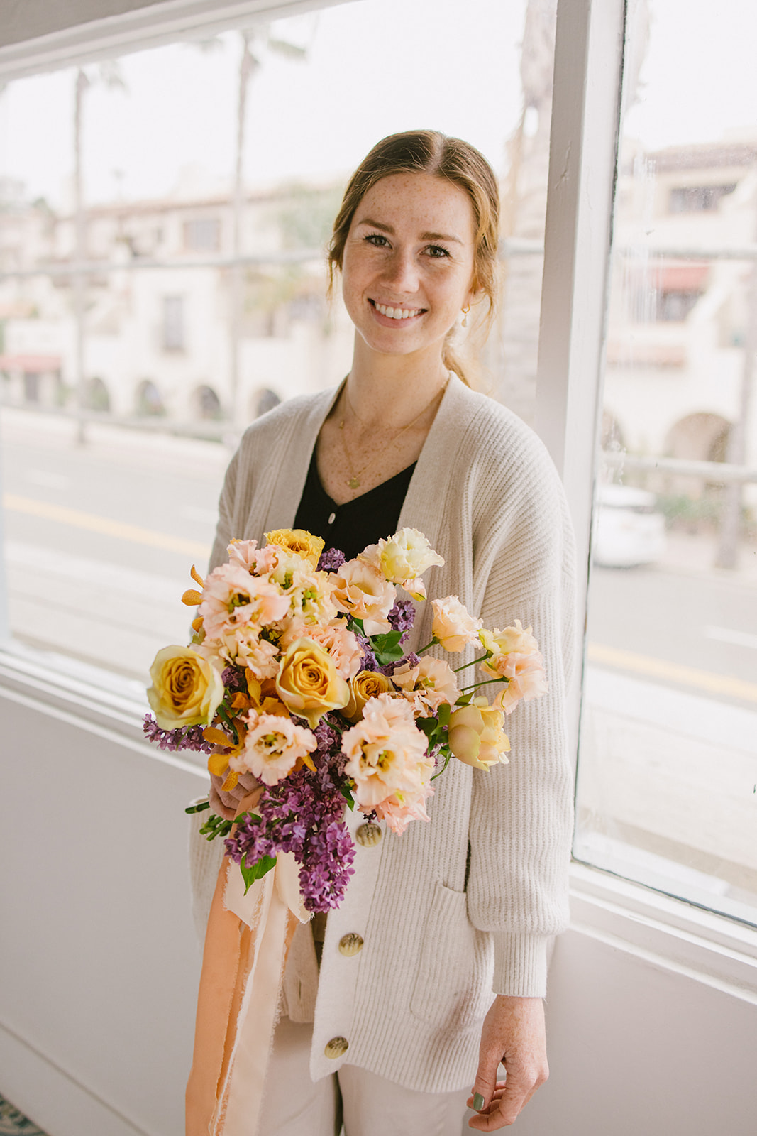 florist holding the wedding bouquet 