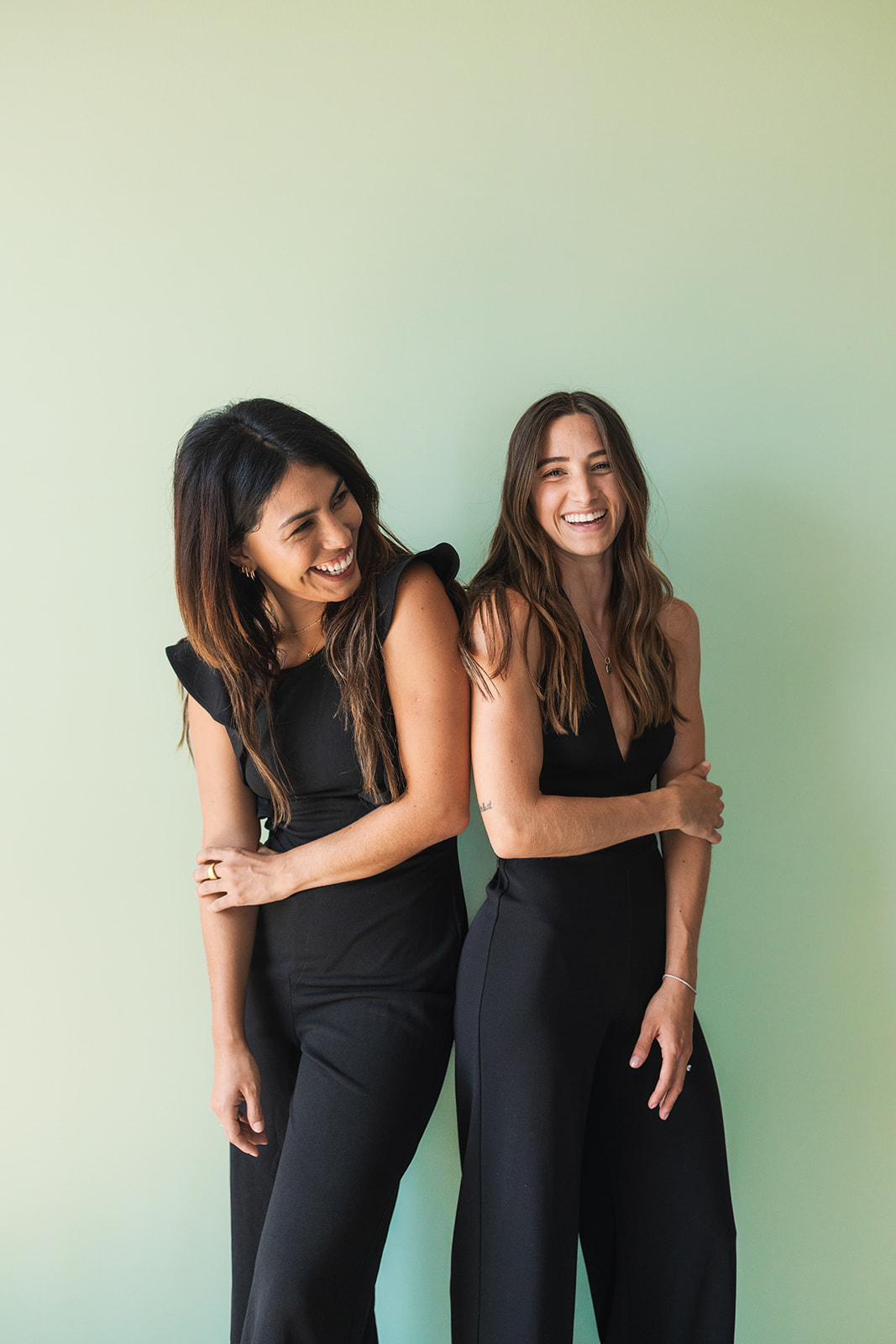 two business owners smiling in studio during a branding session 