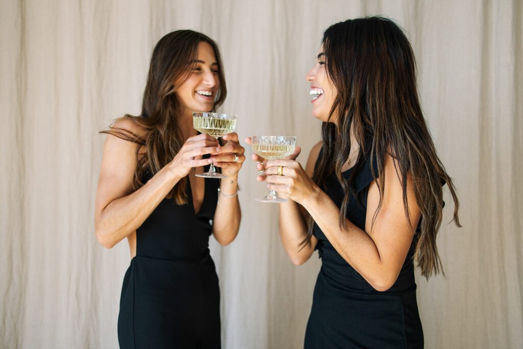 two girls with champagne during a Small Business Branding Photography shoot 