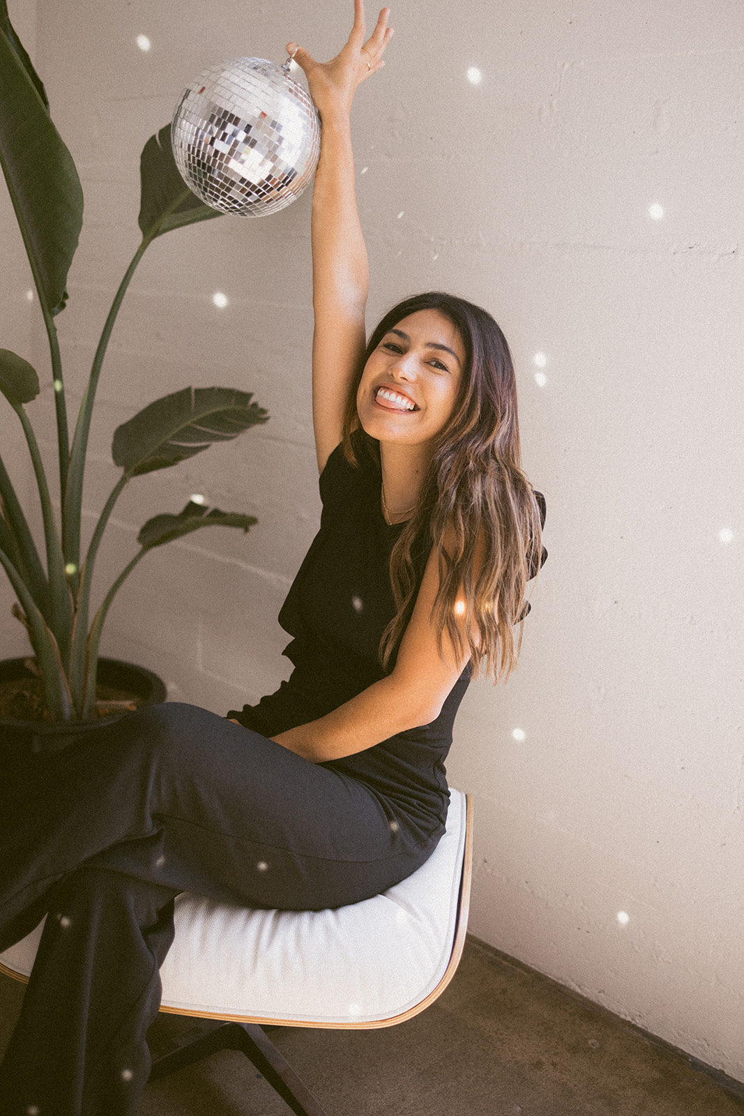 branding headshot of a business owner holding a disco ball 