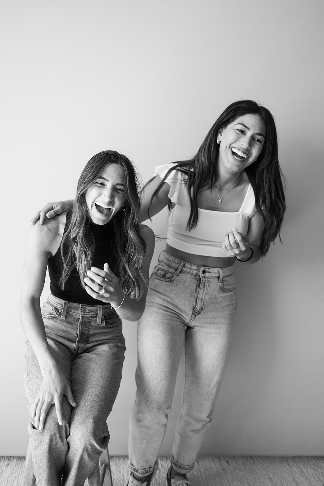 two business owners laughing together during a Small Business Branding Photography shoot 