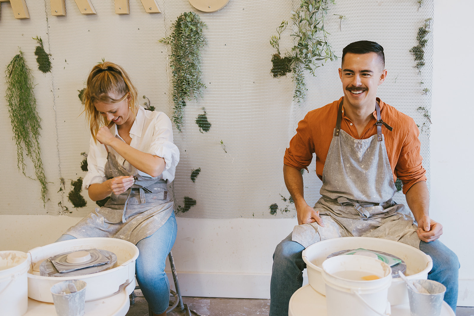 a couples getting ready to make art together during a date night photoshoot 