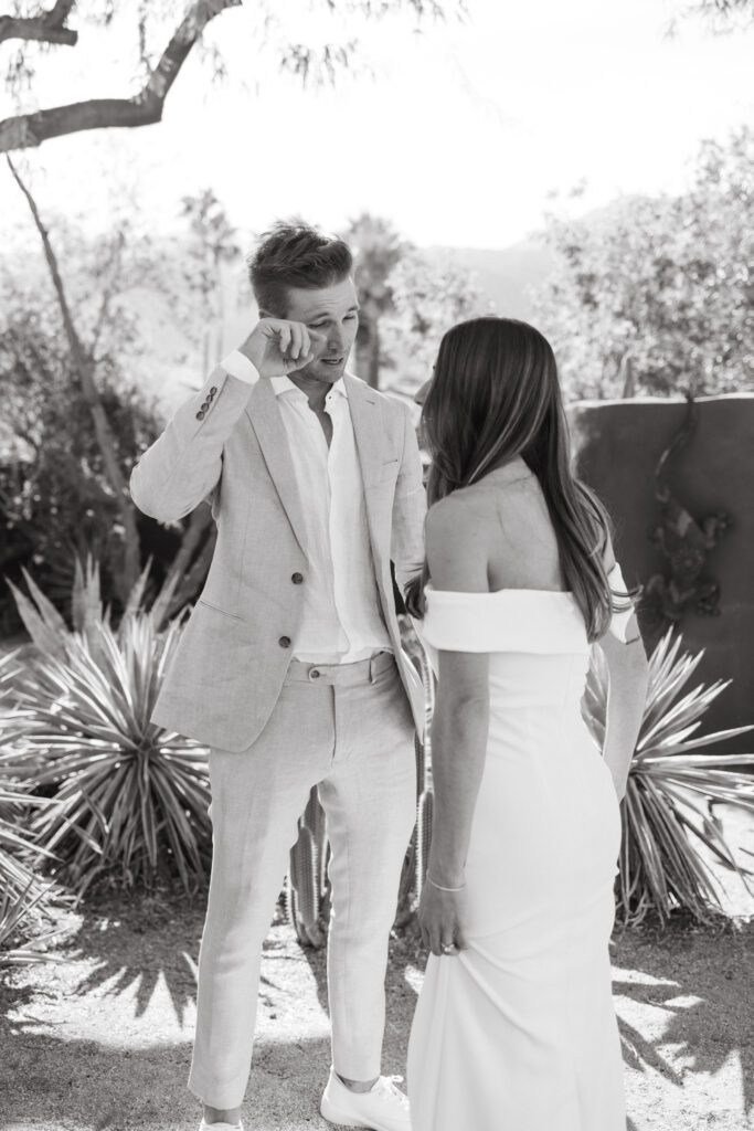 groom wiping his tears during private vow reading 