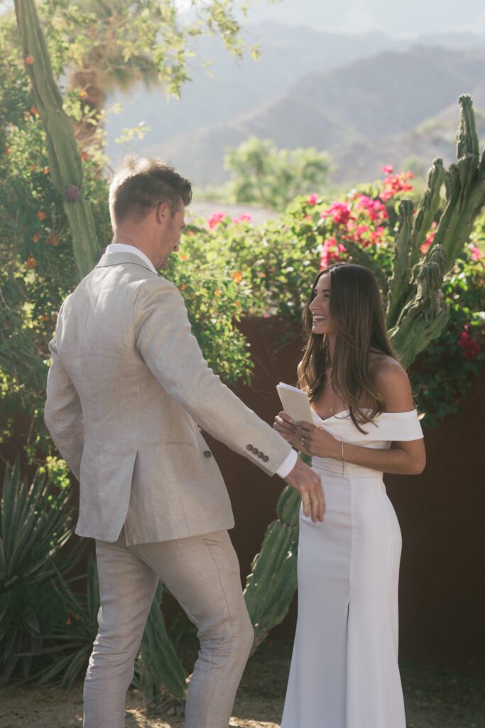 bride and groom reading their vows privately 