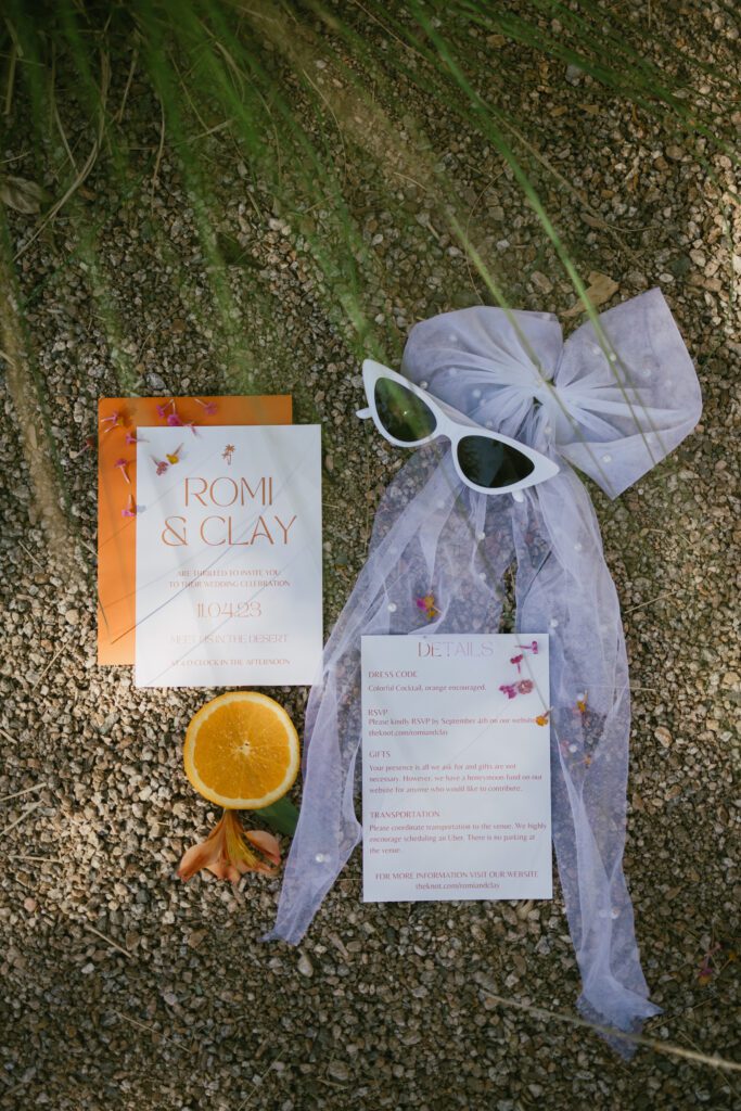 flatlay details of brightly colored Palm Springs wedding 