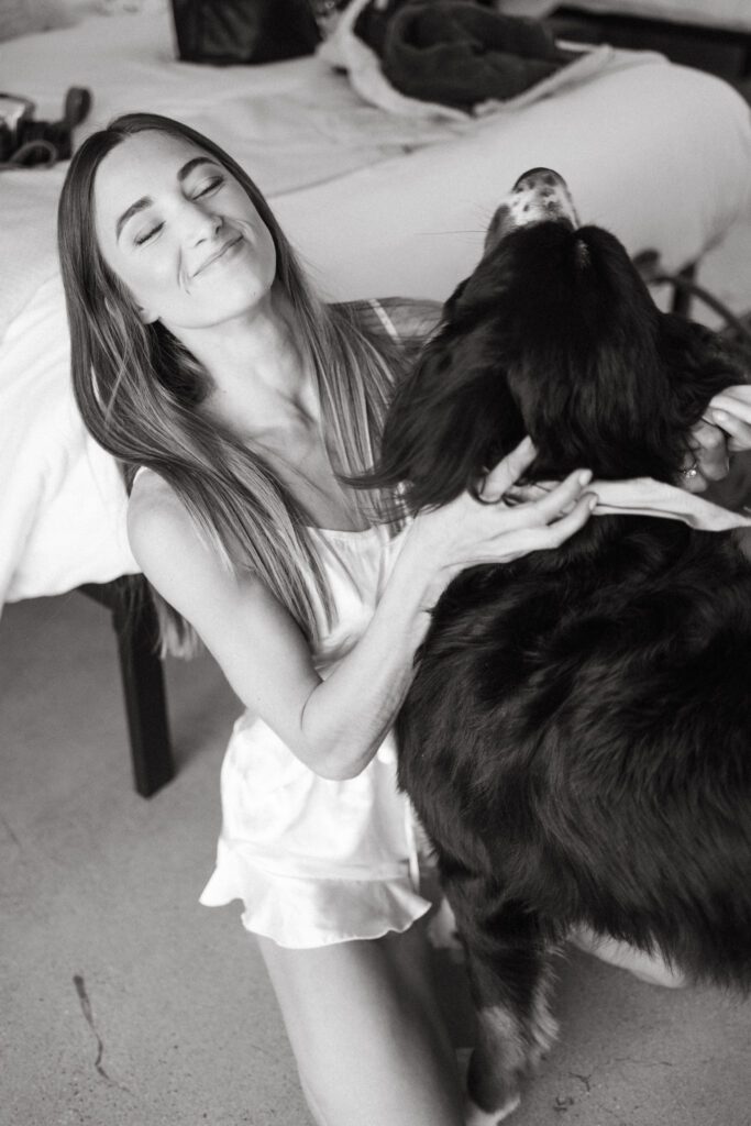 bride and her dog while she is getting ready for Palm Springs wedding 