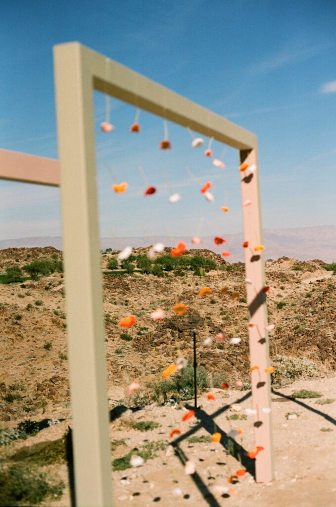 floating flowers on Palm Springs wedding arch