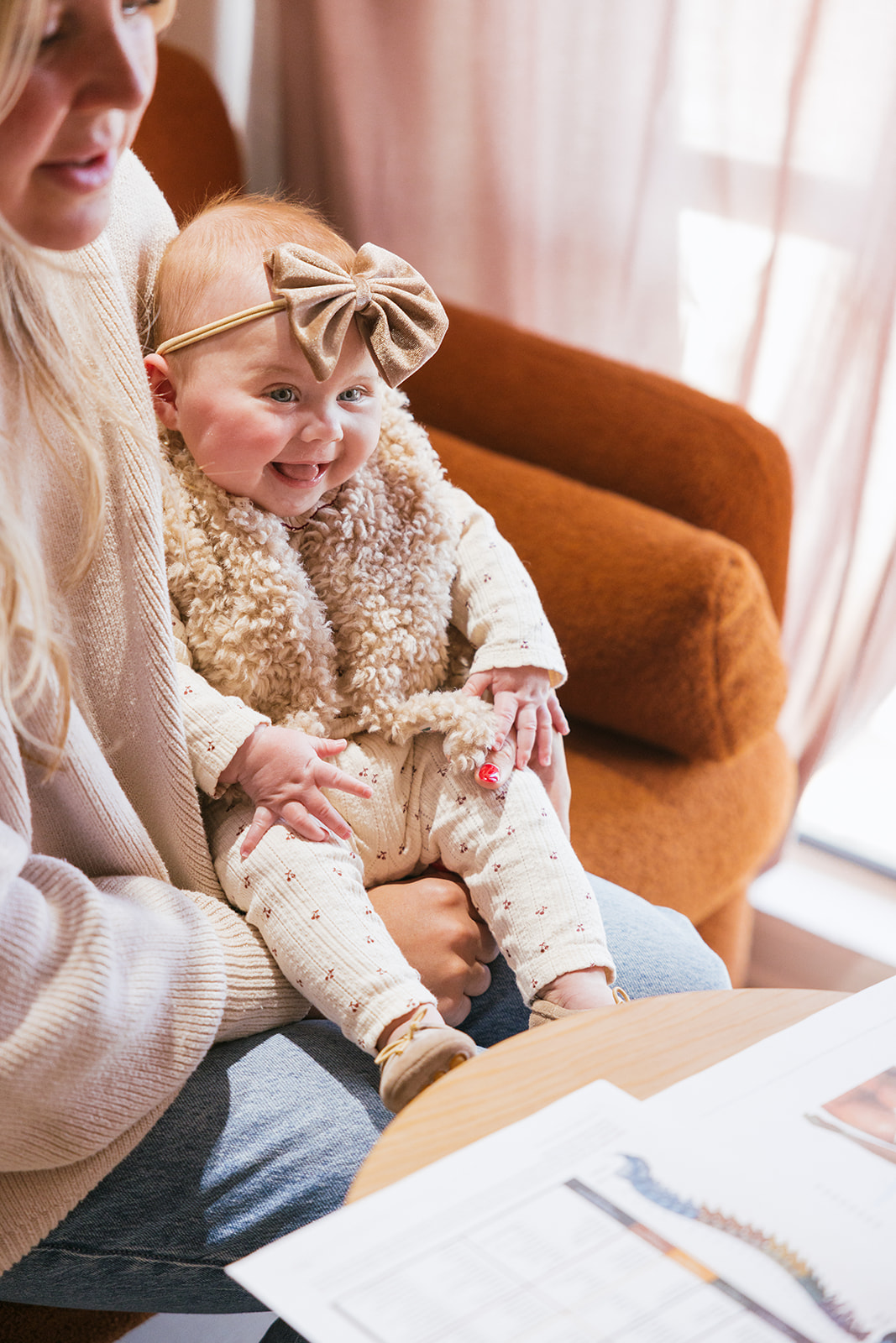 a baby smiling at the doctor during lifestyle branding photography photos