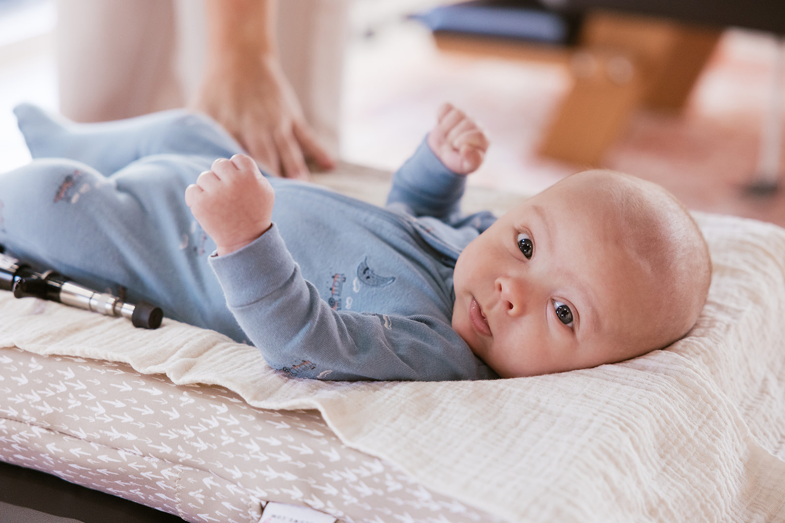 a baby laying on the table at the chiropractor during brand photos 