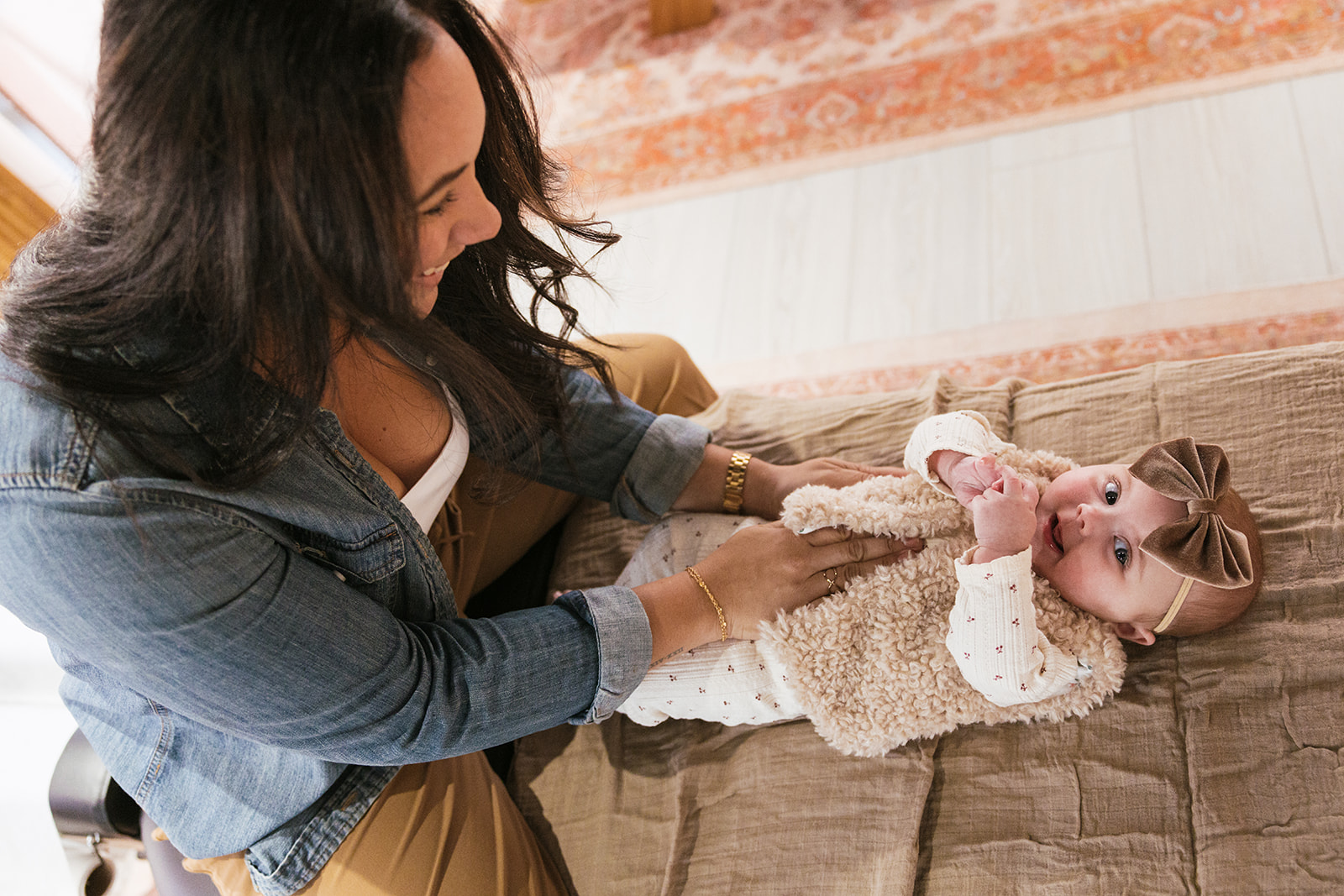 lifestyle branding photography for a Chiropractor as she works on a baby