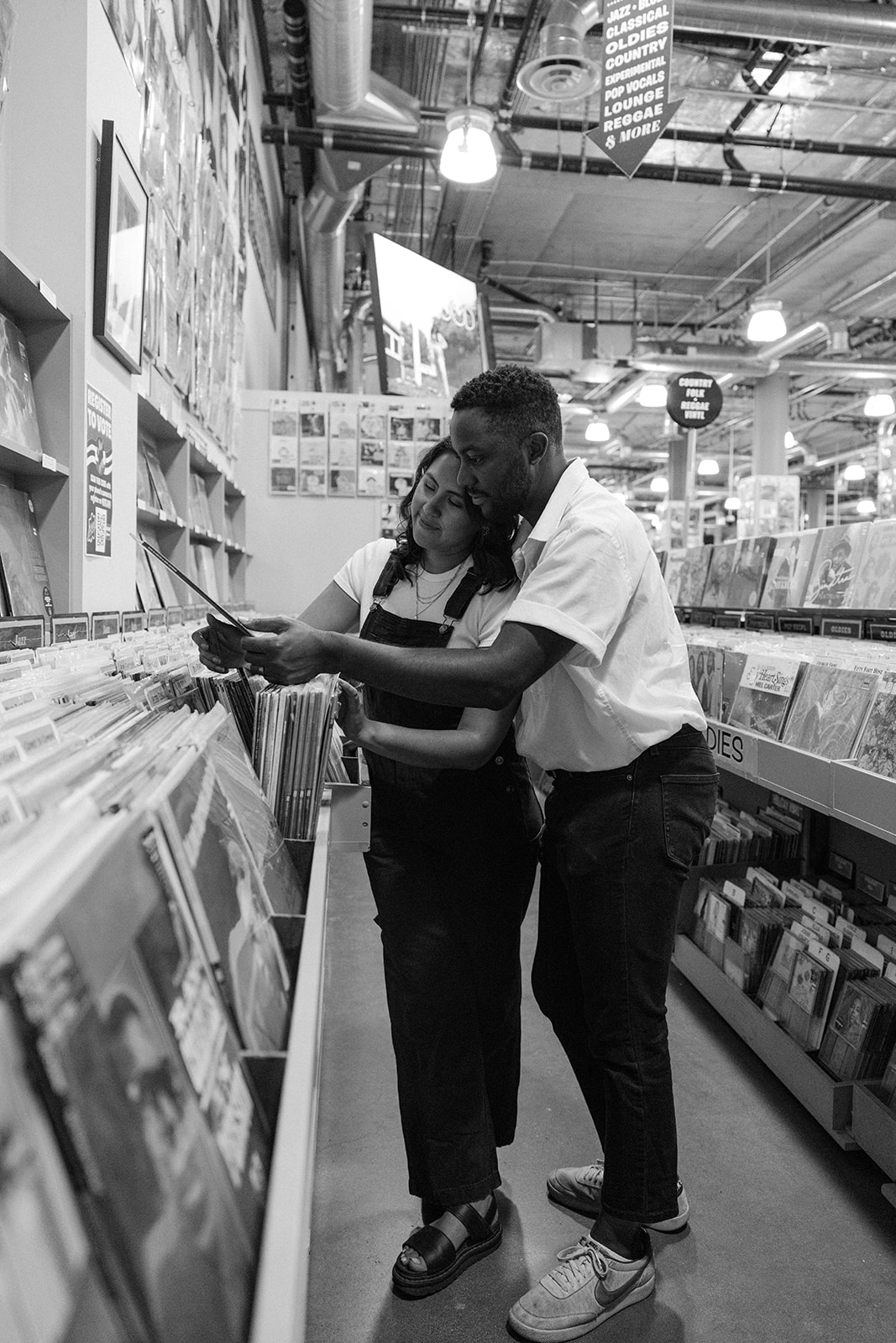 a couple looking through records together 