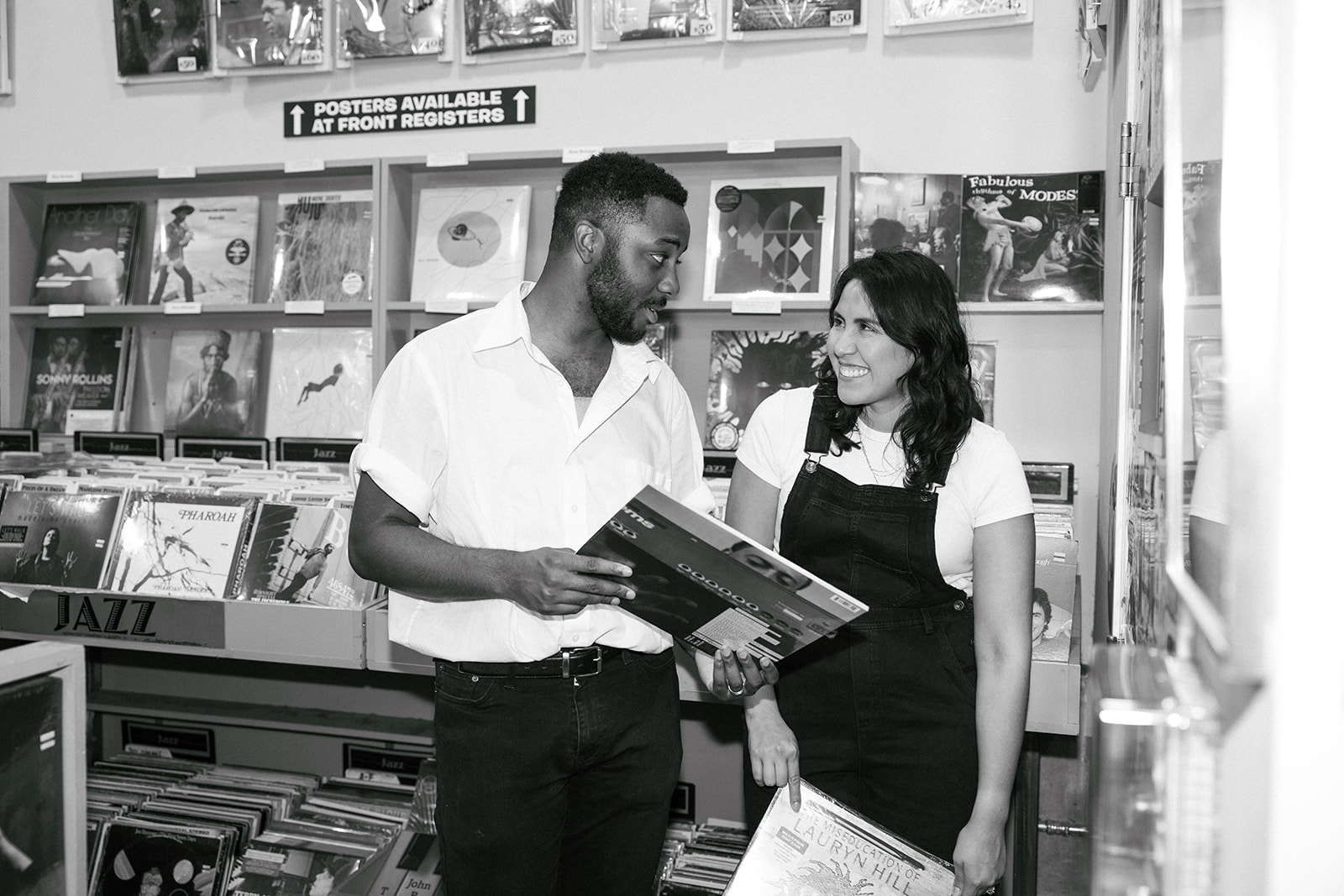 a man showing a woman a record 
