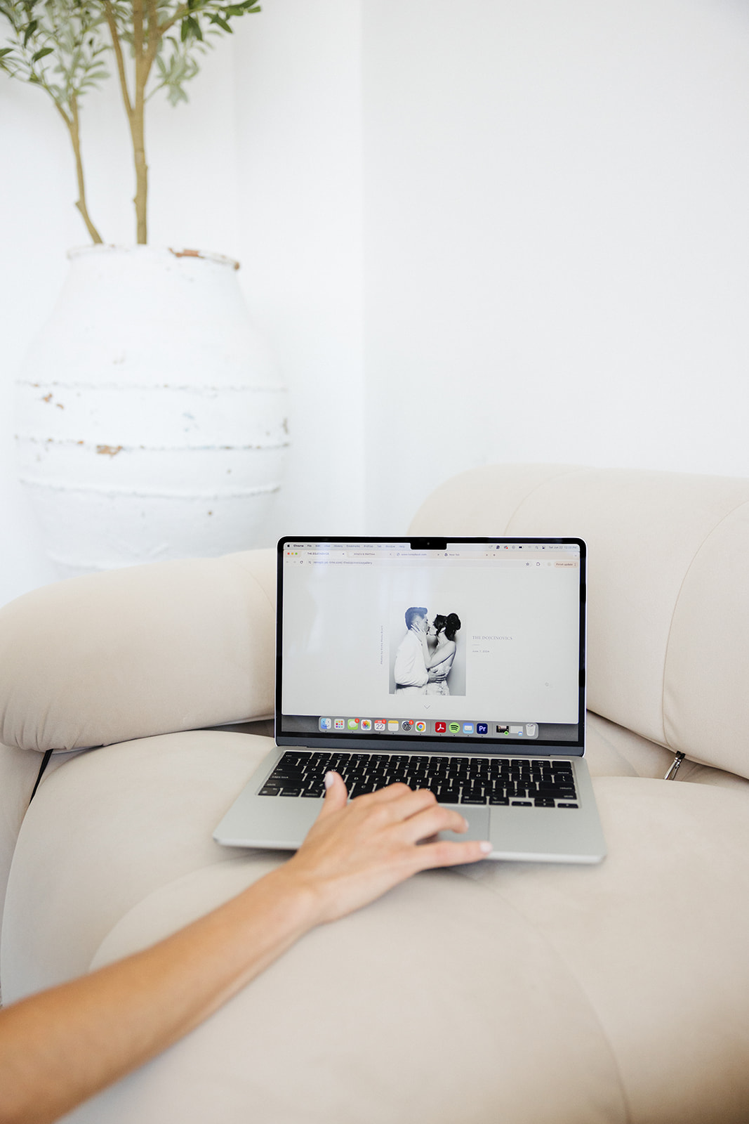 a computer with a business's branding materials on screen for a photoshoot 