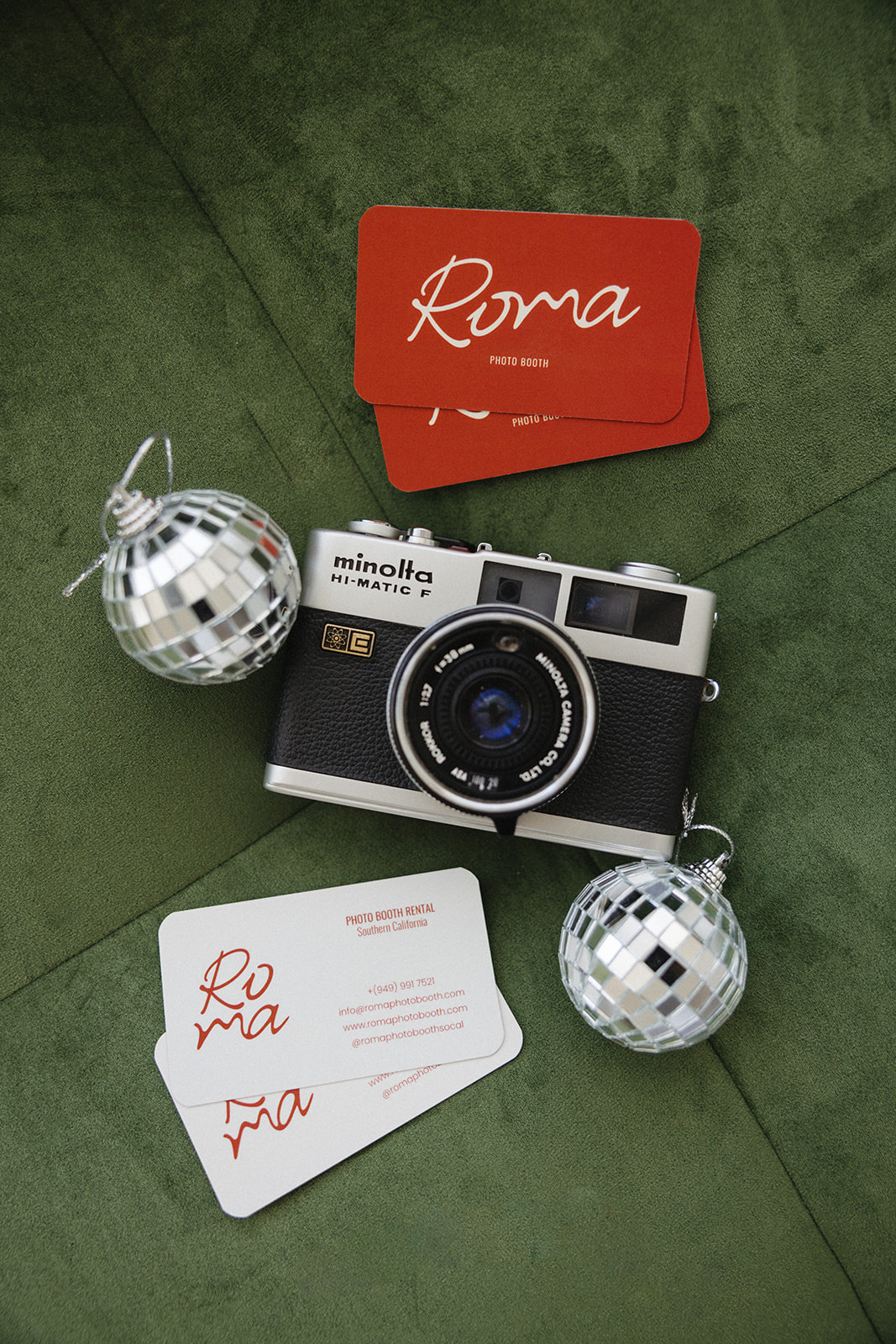 branding photography props on a deep green couch in OC