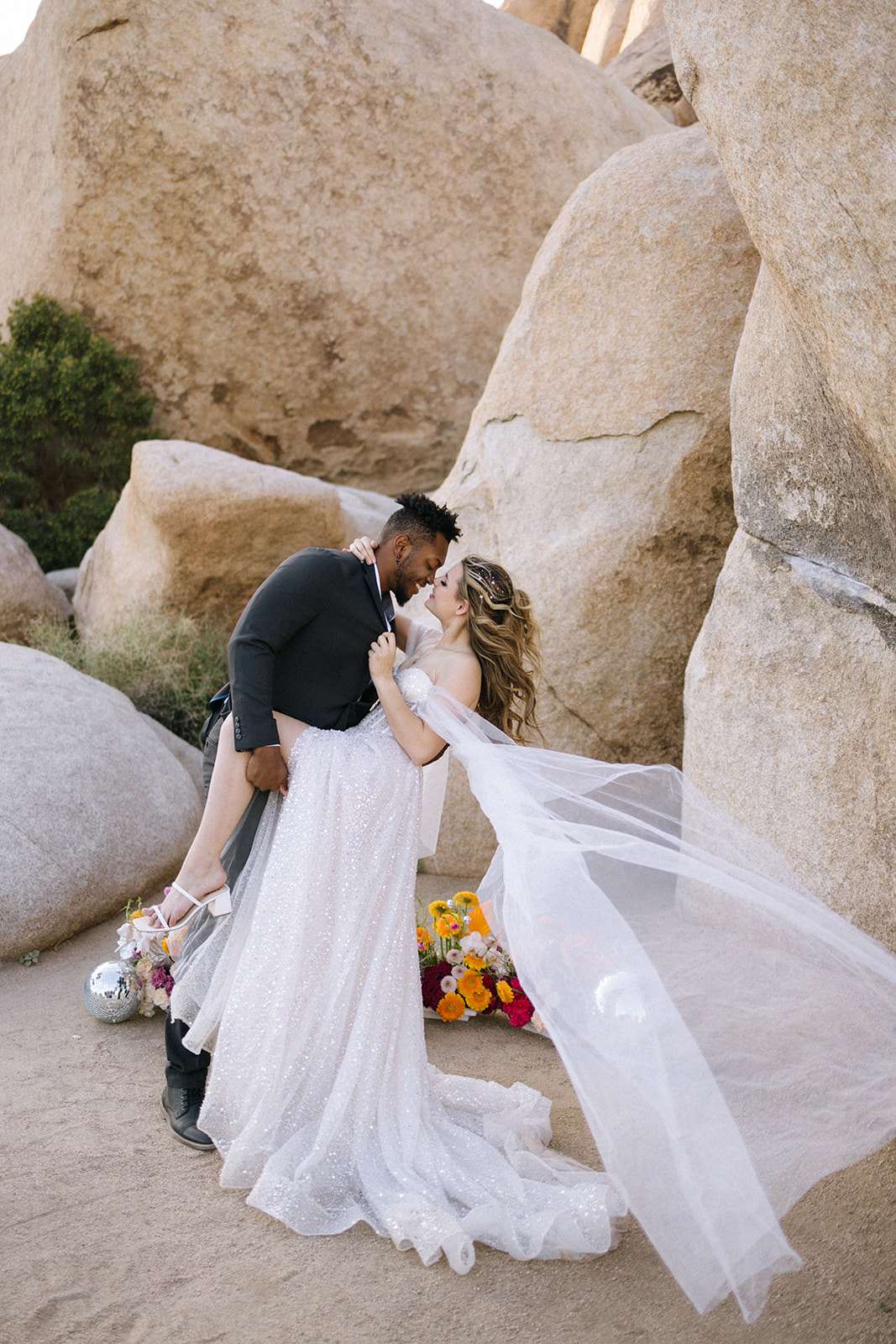 groom dipping the bride in a styled southern California elopement shoot 