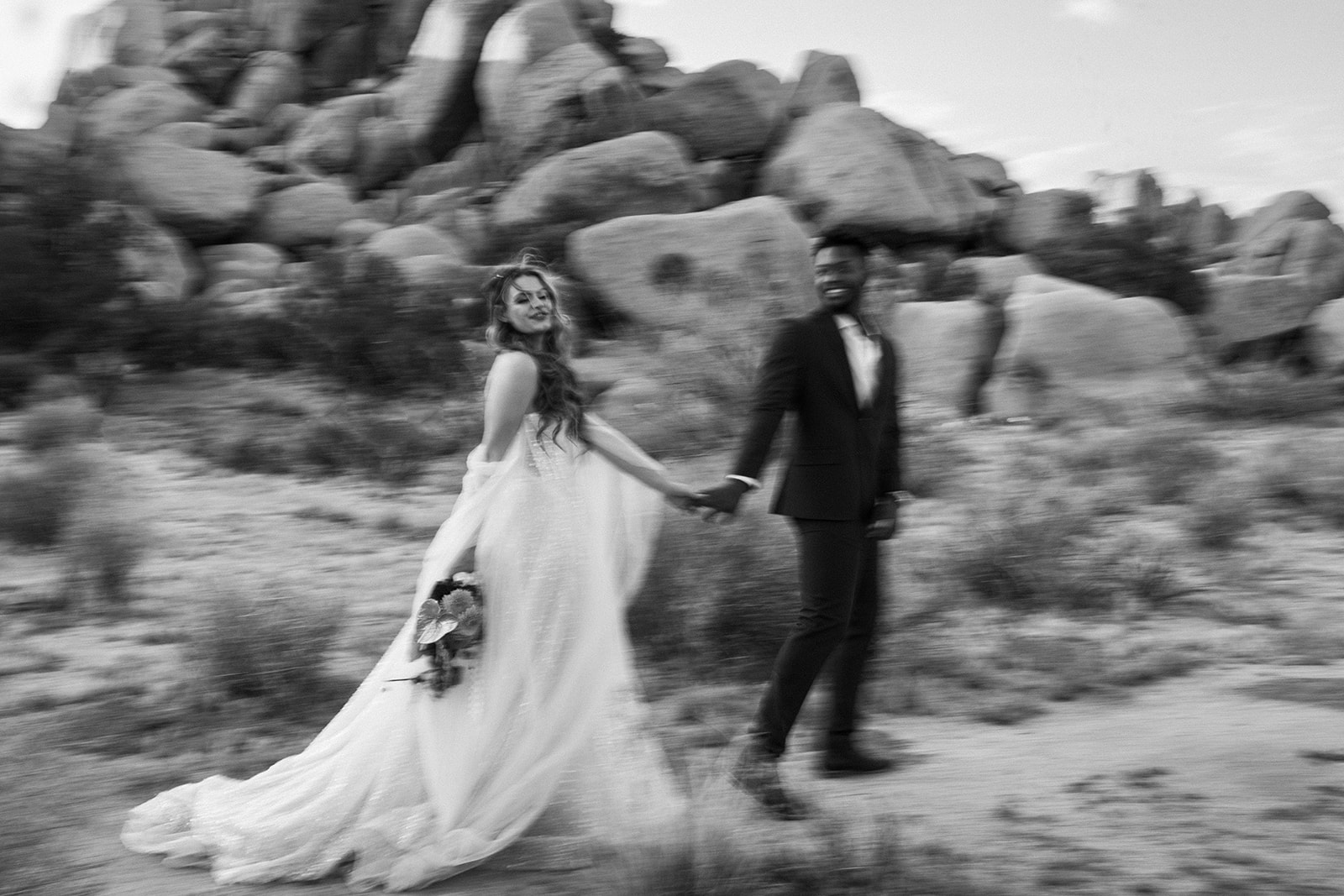 blurry photo of the bride and groom walking during a southern California elopement styled shoot 
