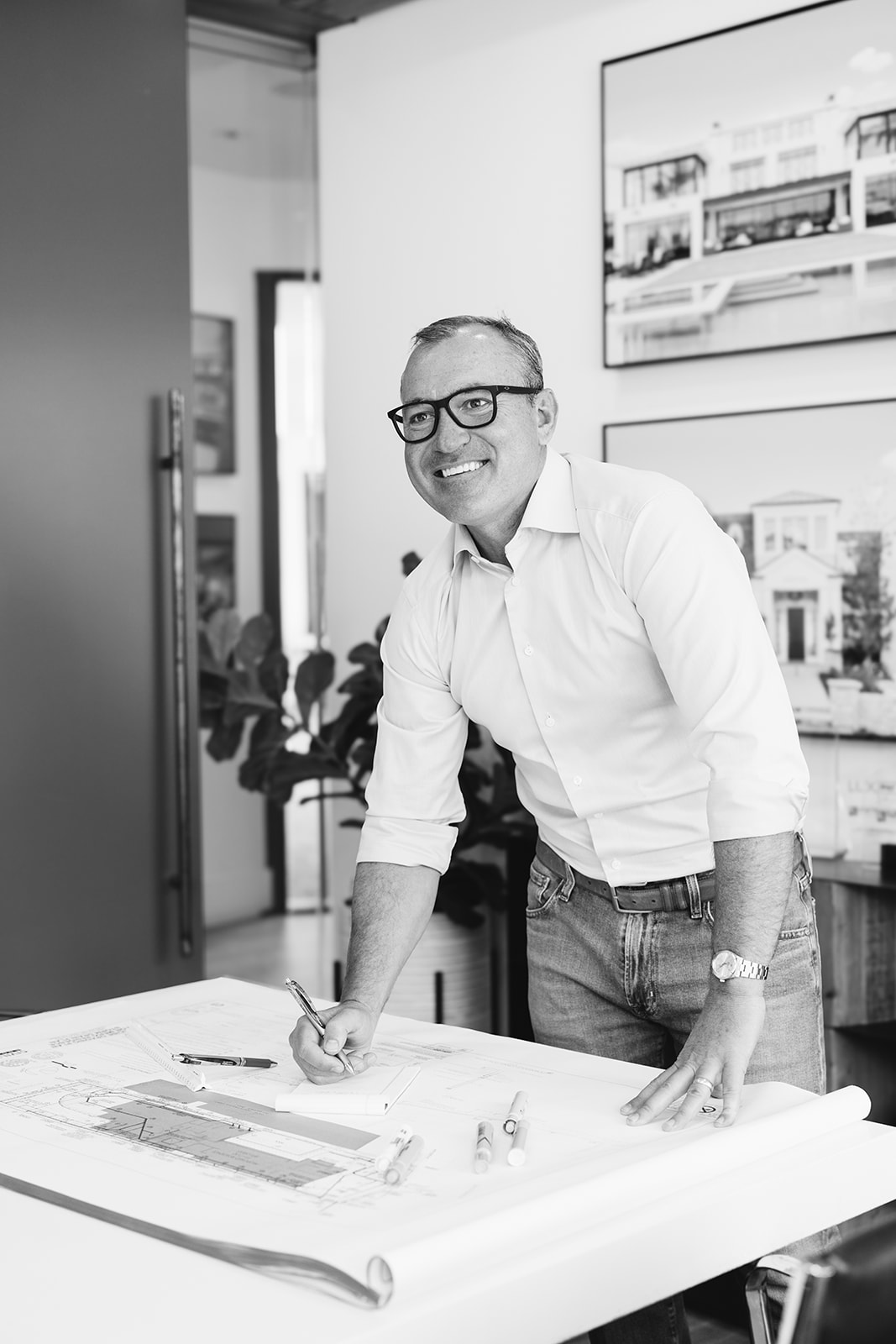 a man smiling in his office during a brand photoshoot in Newport Beach 