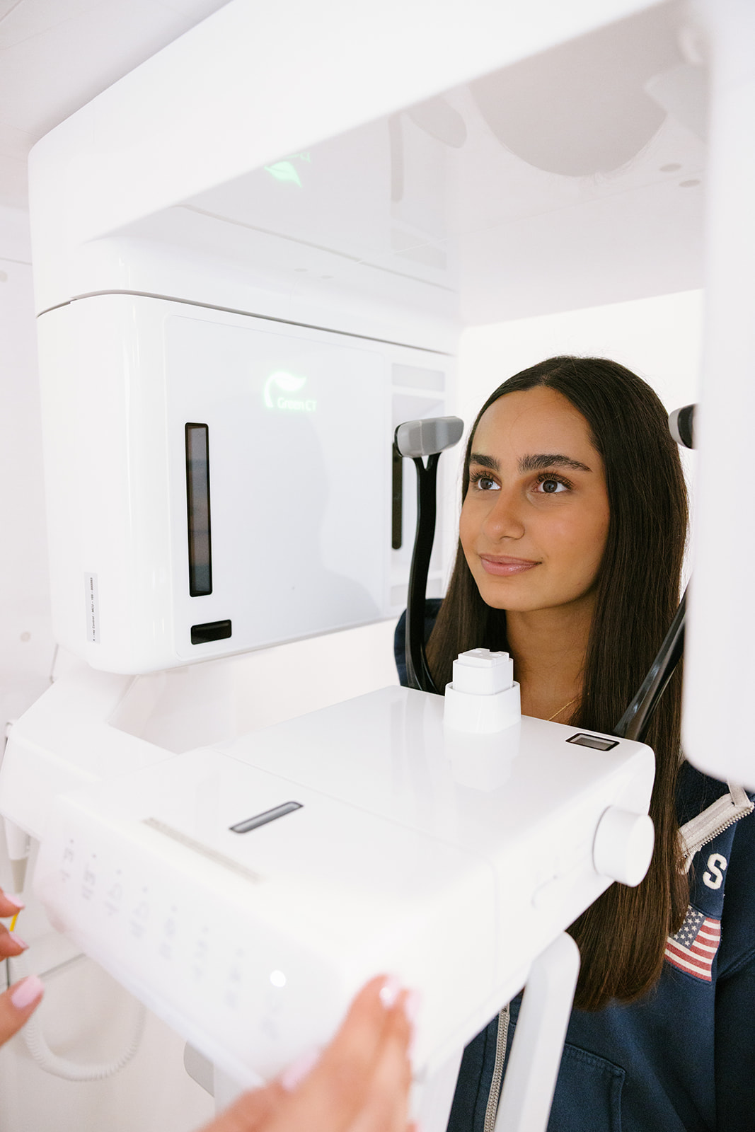 a client getting an x-ray of her teeth 