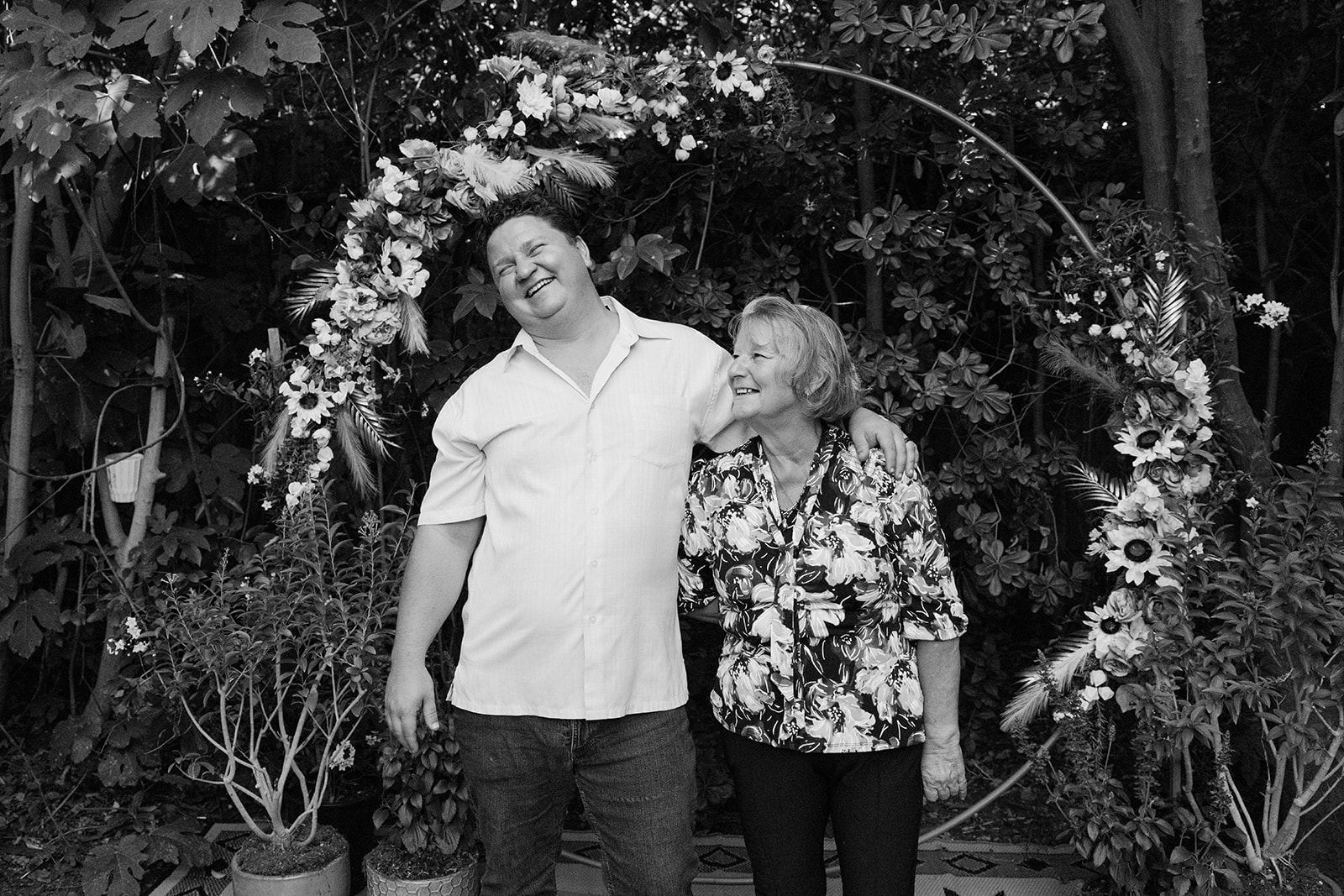 the groom laughing with his family member 