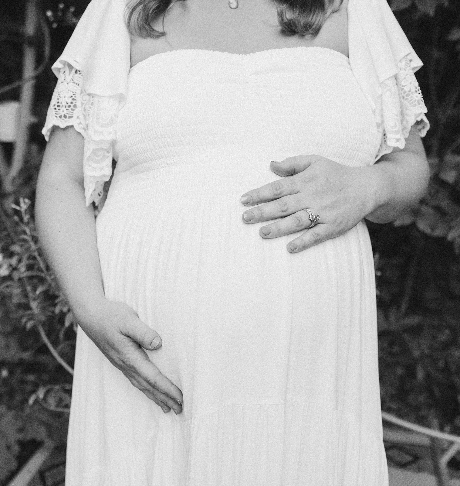 a pregnant woman holding her belly 