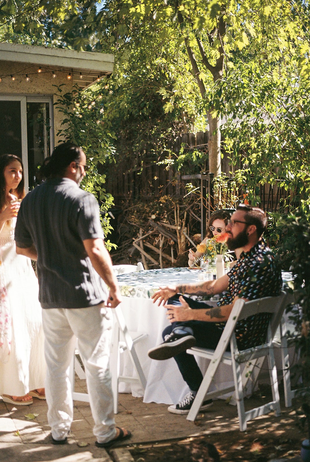 film wedding photo of the guests chatting 
