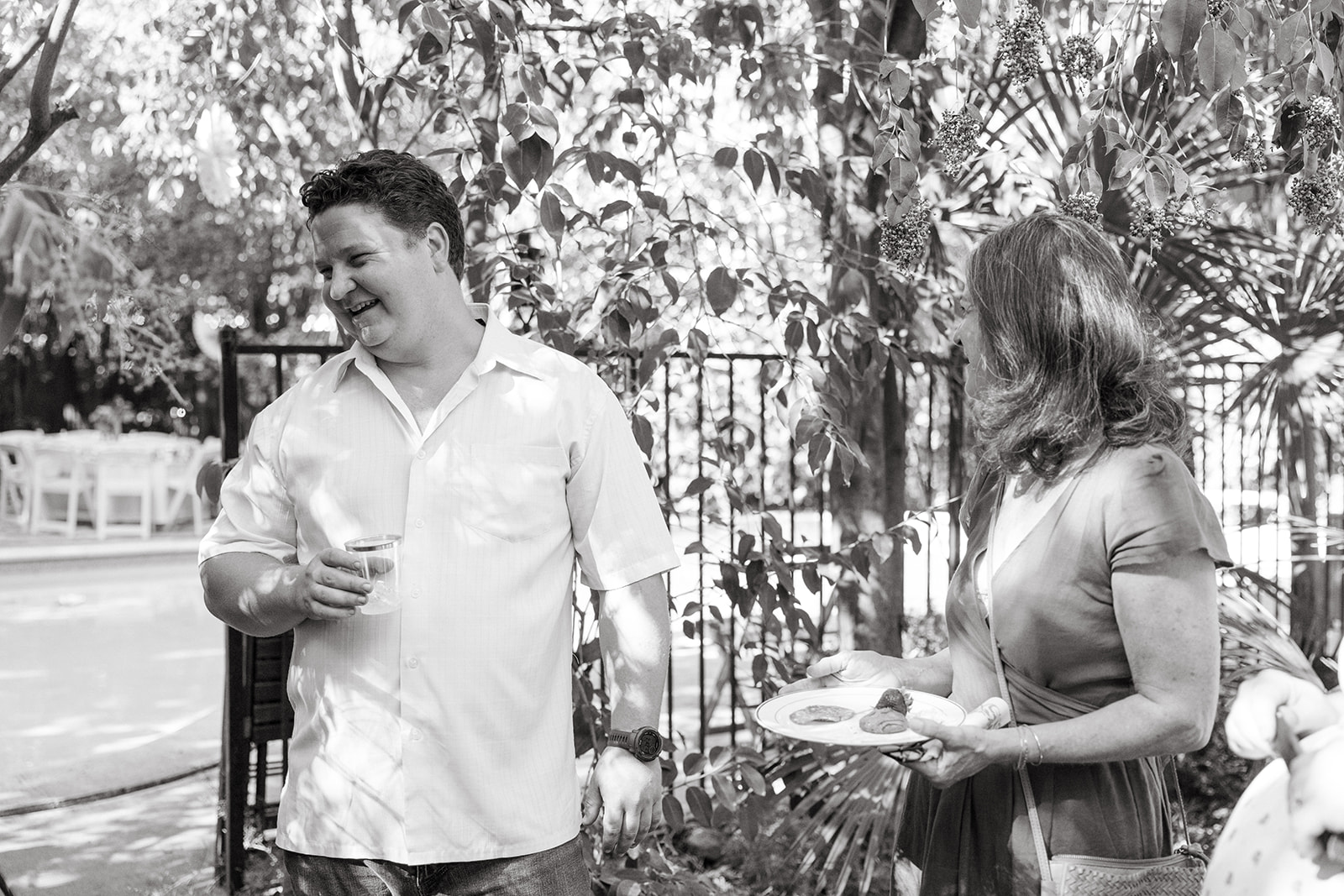 the dad to be laughing with guests 