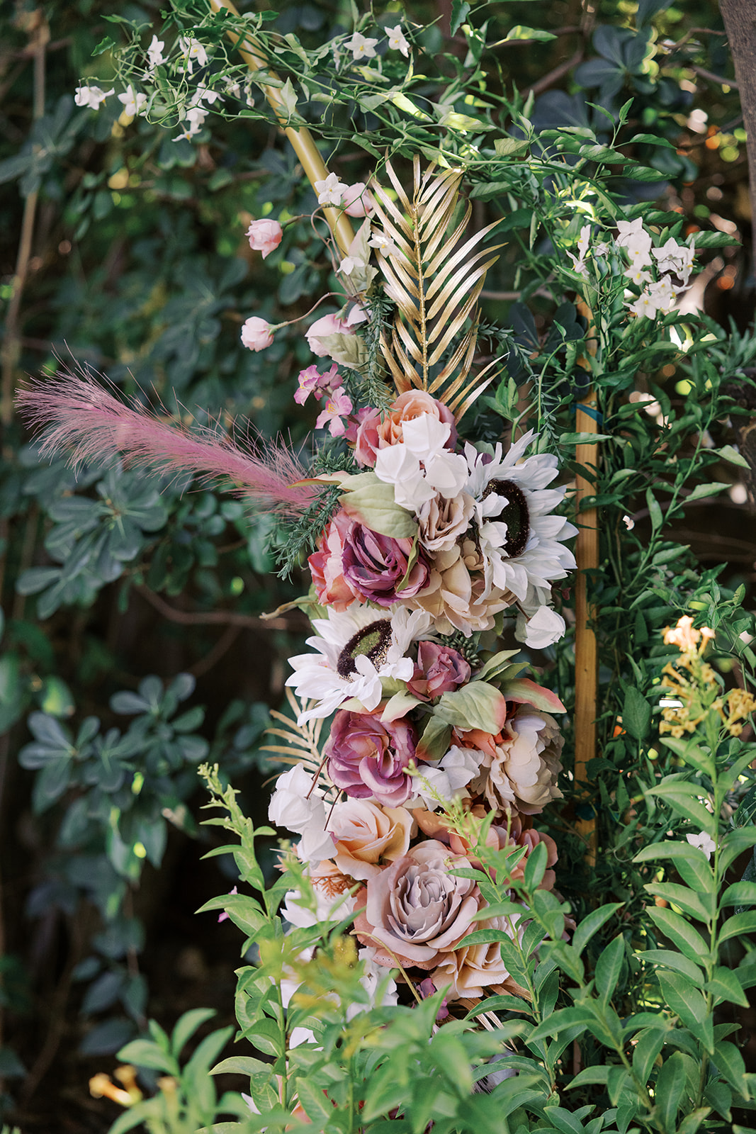 closeup of the floral installation on the wedding arch 