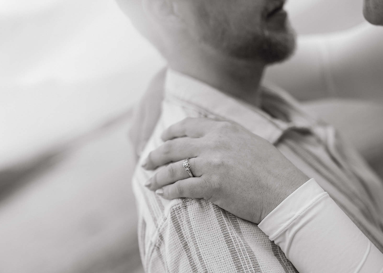 a closeup of a woman's engagement ring 