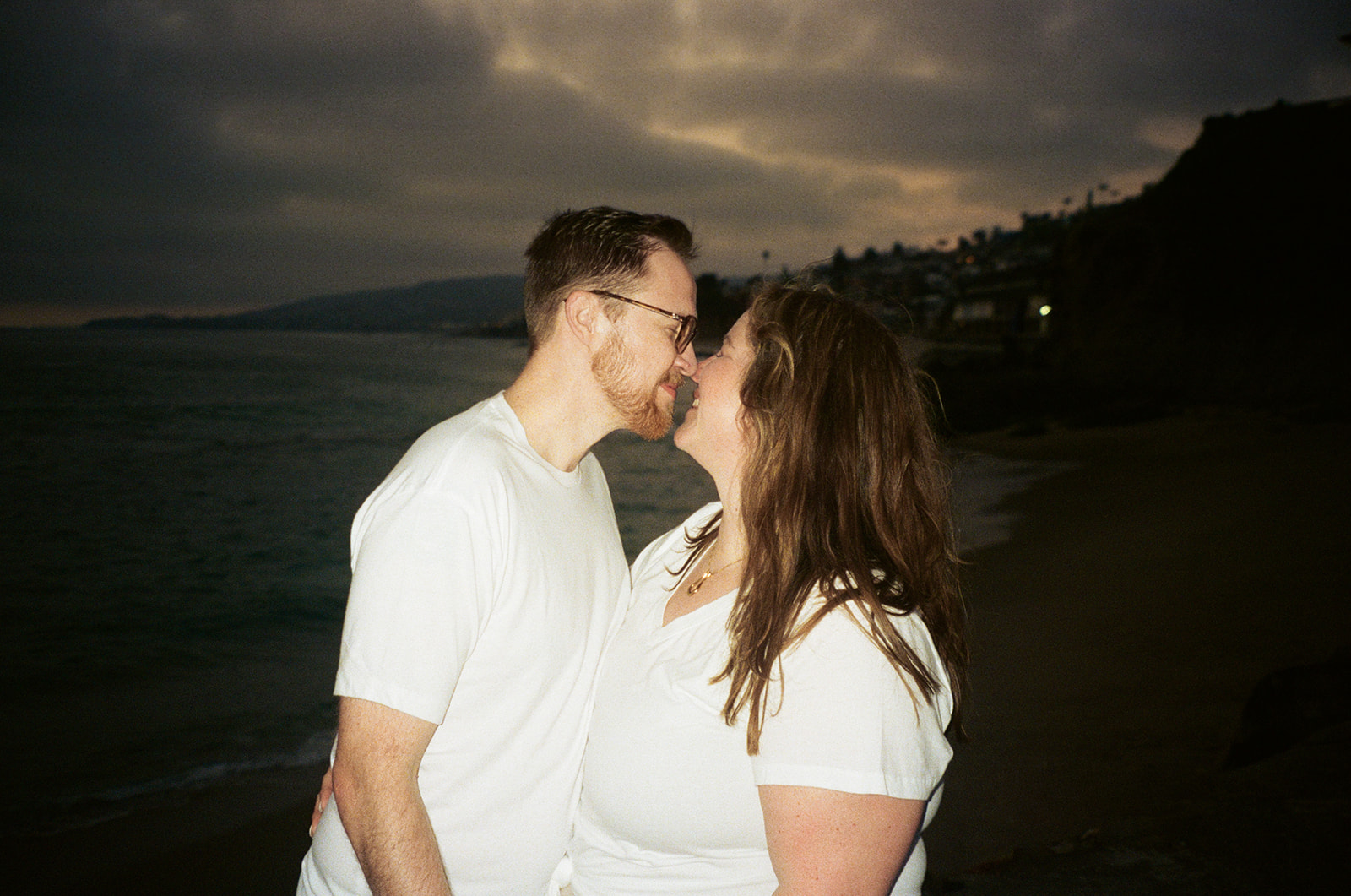 night flash beach engagement photos on film 